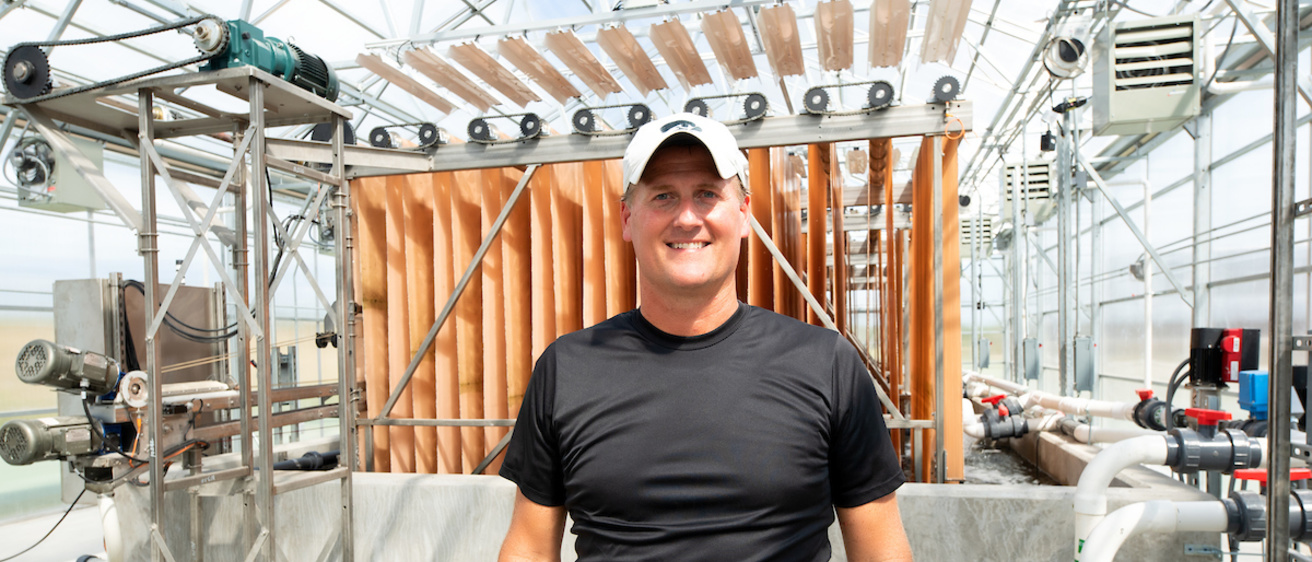 Craig just stands in front of IWWERP structure